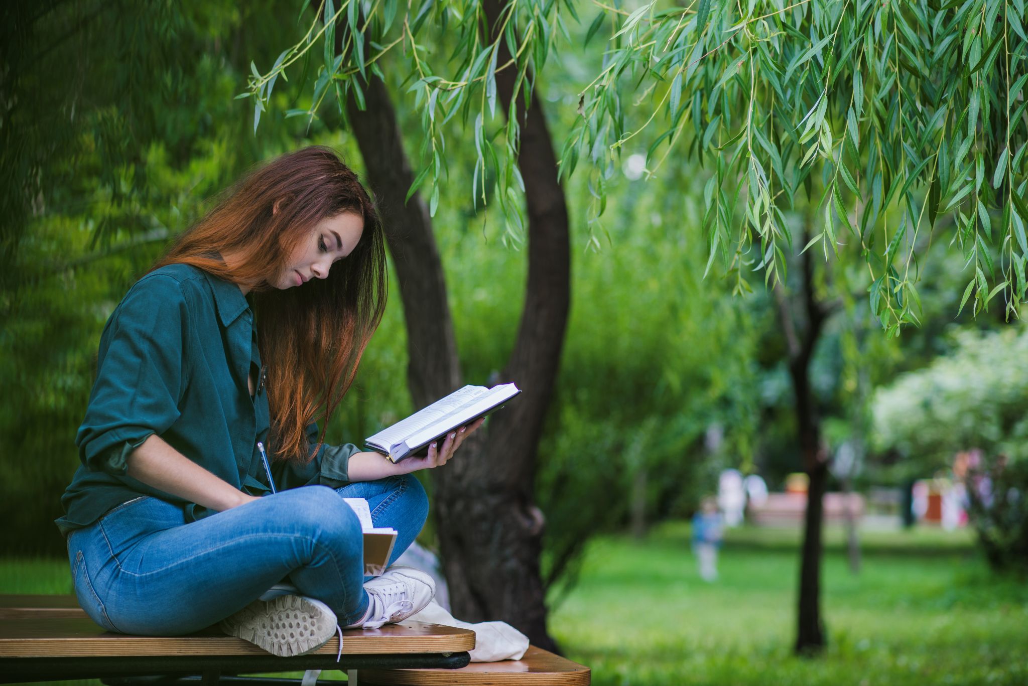 girl-sitting-table-park-writing2